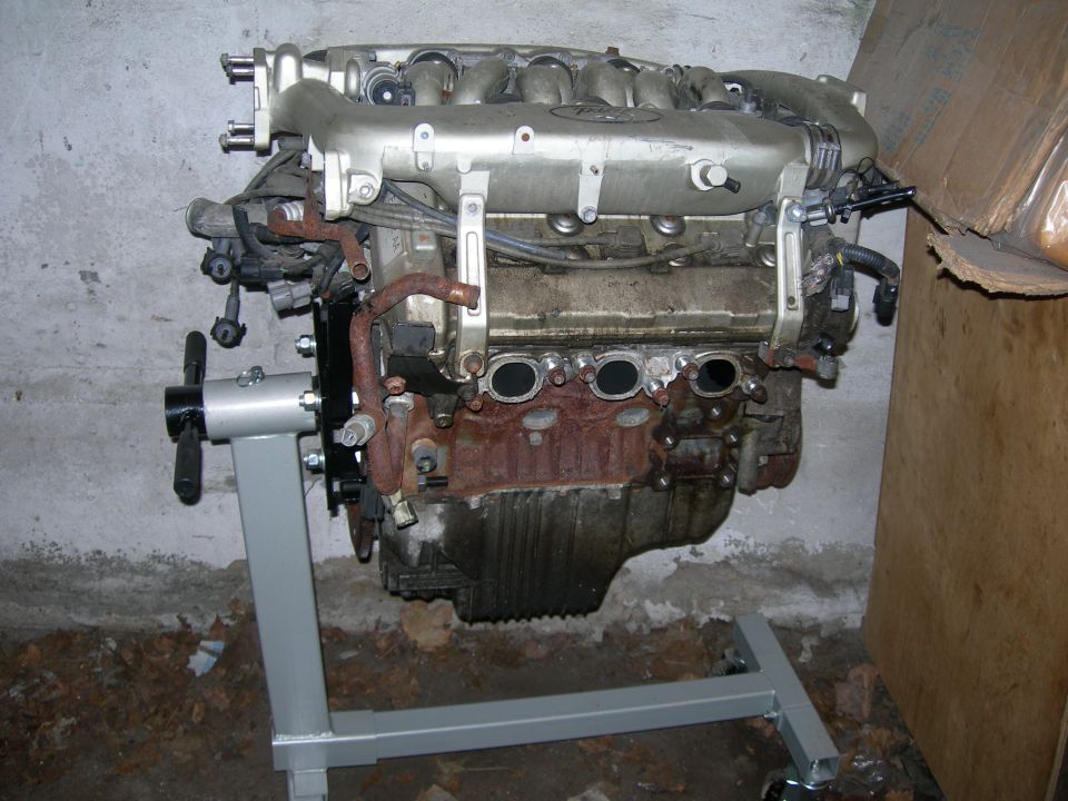 Ford SHO V6 engine on a rolling engine stand with polished intake manifold, exhaust removed