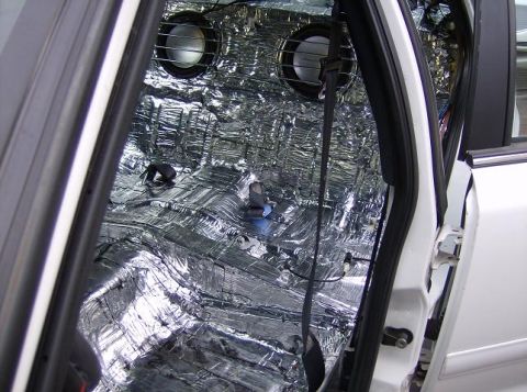1999 Ford Crown Victoria - Sound deadening material covers the interior of the vehicle, with speakers installed.