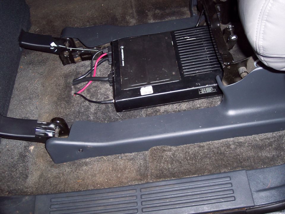 radio equipment mounted under the passenger seat of a vehicle