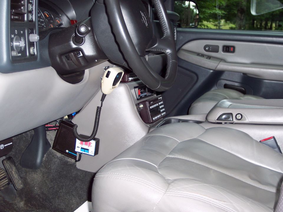 2002 Chevrolet Suburban interior with CB radio and gray leather seats