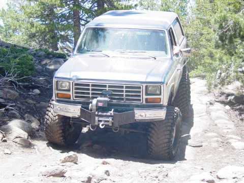 1986 Ford Bronco - This 1986 Ford Bronco is equipped for off-road adventures on a dirt path.