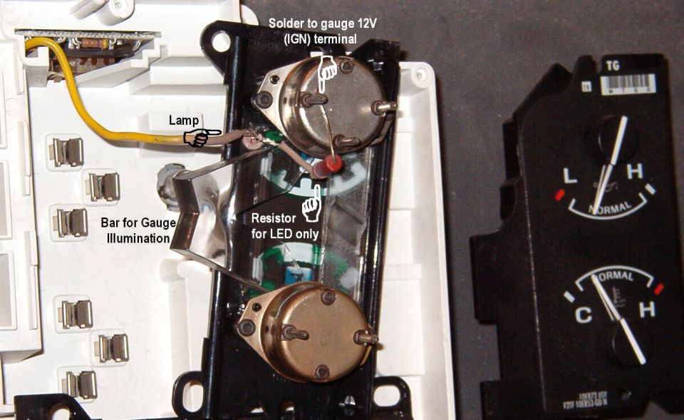 Disassembled gauge with soldered LED resistor mod and labeled illumination components