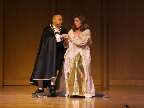 1996 Ford Probe - Two performers in costume on a wooden stage, likely during an opera or play.