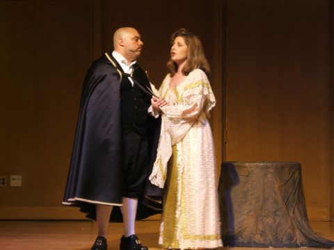 1996 Ford Probe - Two actors perform on a stage, dressed in elaborate historical costumes.