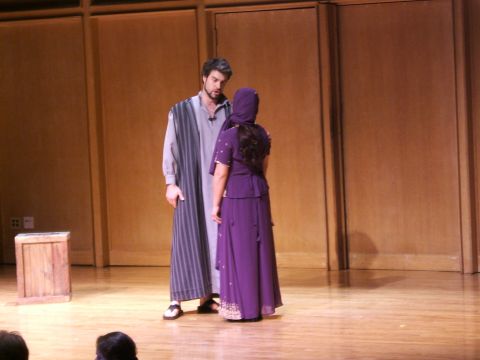 1996 Ford Probe - Actors perform on stage in costume, with a wooden prop to the left.