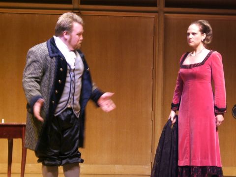 1996 Ford Probe - Two actors perform on a stage, dressed in period costumes.