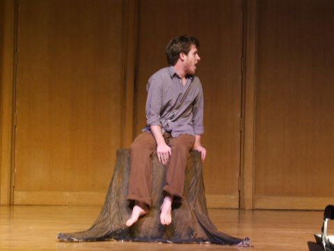 1996 Ford Probe - A man sits on a stage prop during a performance, with a watermark visible in the lower right corner.