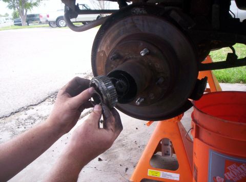 1986 Ford Bronco - When you remove the locking ring, the mechanical housing for the manual locking hubs should come out. Notice it is spring loaded from the b…