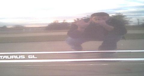 1993 Ford Taurus - Reflection of photographer in car door panel shows 'TAURUS GL' text.