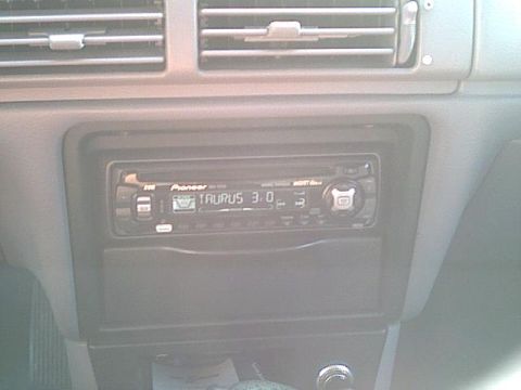 1993 Ford Taurus - The interior of a 1993 Ford Taurus features a Pioneer stereo system that displays 'TAURUS 3.0'.