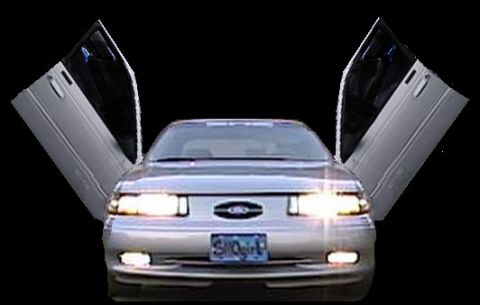 1993 Ford Taurus - This 1993 Ford Taurus features custom butterfly doors, giving it a unique profile.