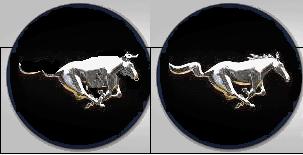 1993 Ford Taurus - Close-up of two Ford Mustang running horse emblems, likely from a grille or wheel.