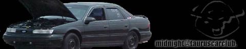 1993 Ford Taurus - A dark sedan sits with its hood open, revealing the engine bay. A spoiler is visible on the rear trunk.