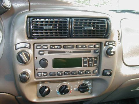 1993 Ford Taurus - Interior view of a vehicle's dashboard, focusing on the radio and climate control system.