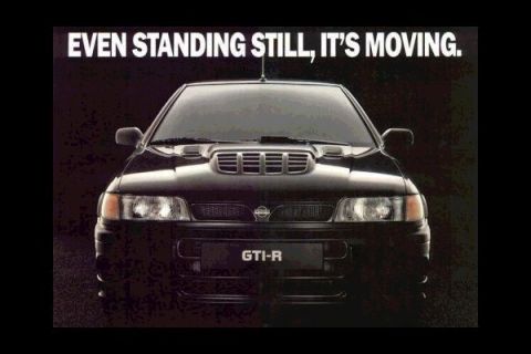 1993 Ford Taurus - This black Nissan Pulsar GTI-R is shown from the front, highlighting its distinctive hood scoop and badging.