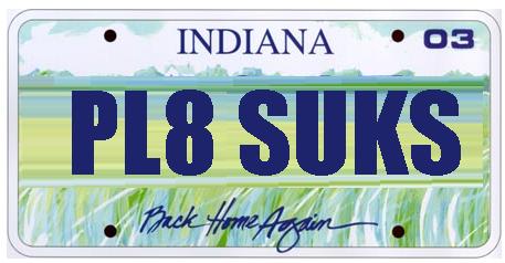 1993 Ford Taurus - An Indiana license plate displays the custom text "PL8 SUKS" and the slogan "Back Home Again".
