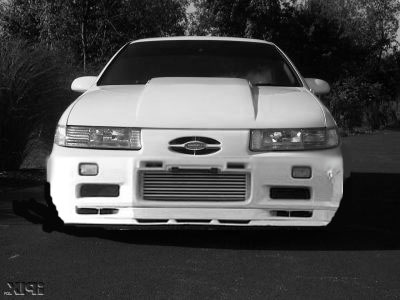 1993 Ford Taurus - Front view of a modified 1993 Ford Taurus showing custom hood and intercooler.