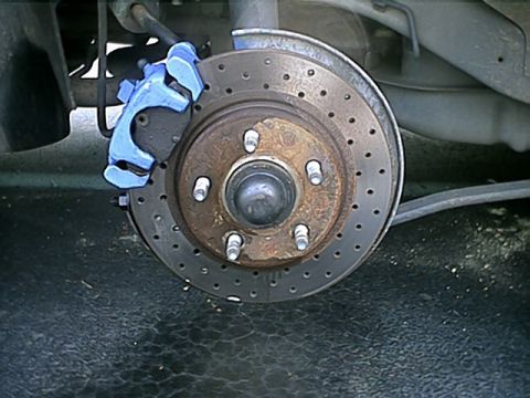 1998 Ford Taurus - Rear passenger side shot of cross-drilled rotors and blue caliper.