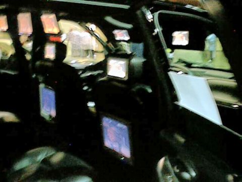 1998 Ford Taurus - The interior of a vehicle is visible, numerous screens and ambient lighting.