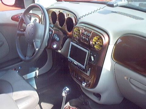 1998 Ford Taurus - Interior view of a car's dashboard with a custom screen and shifter.