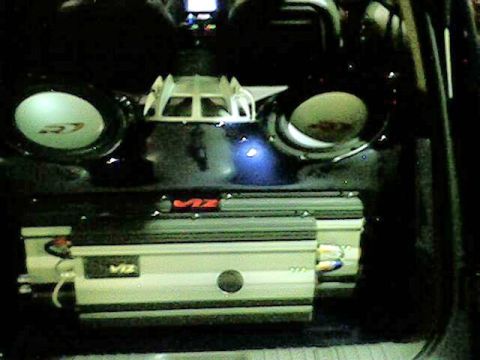 1998 Ford Taurus - Custom car interior features a pair of subwoofers and a VIZ amplifier, likely for a sound system upgrade.