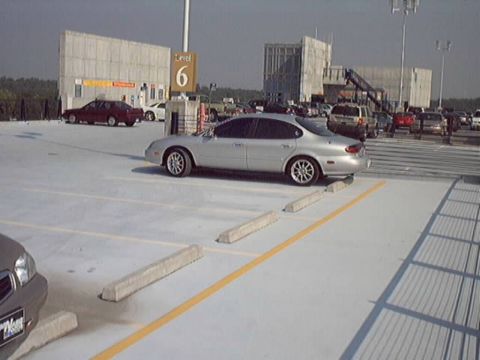 1998 Ford Taurus - Silver 1998 Ford Taurus parked on Level 6 of a parking garage.