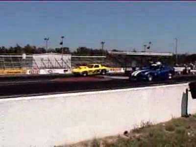 1998 Ford Taurus - Drag race between a Dodge Viper and a 1969 Corvette.