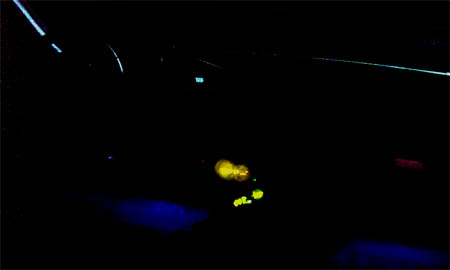 1993 Ford Taurus - The illuminated dashboard lights glow in various colors, including yellow and blue, against the dark interior of the vehicle.