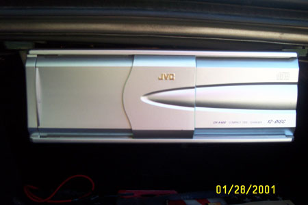 1993 Ford Taurus - JVC car stereo unit, likely an aftermarket addition, shown in a dark interior space.