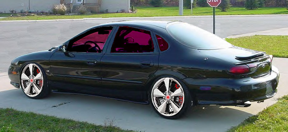 SHO on 20's with red tint and some crazy calipers.