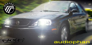 1993 Ford Taurus - This black Mercury sedan is captured in a front 3/4 view, showing the distinctive Mercury logo on the grille.