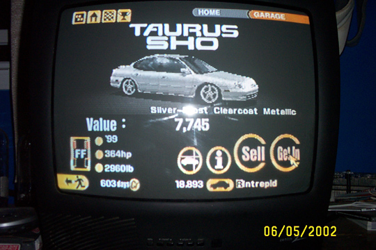 Screen showing a silver car labeled 'TAURUS SHO' with stats like value and horsepower