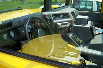 1993 Ford Taurus - Interior view of a yellow vehicle, showing the dashboard and steering wheel.