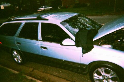 1991 Ford Taurus - babyblue getting her maintenance check up (realy was fixing the headlights. light bulb burnt the connector.)