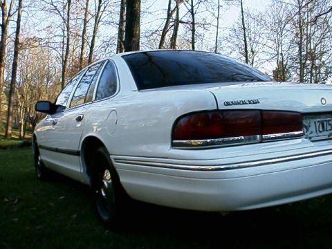 1996 Ford Crown Victoria - Rear view of a white 1996 Ford Crown Victoria parked outdoors.