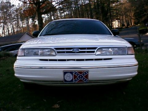 1996 Ford Crown Victoria - Front view of a 1996 Ford Crown Victoria, showing its grille and headlights.