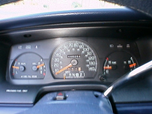 Car instrument cluster with speedometer, gauges, and PRND21 gear indicator