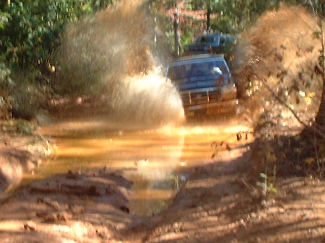 this is one of the baddest pits that i have ever seen.  mark made it through by staying on the left side of the pit cuz the right was so deep that even with a stick we could not touch the bottom, i have heard that if one gets stuck on the right side a trucks interior is screwed b/c mud will get into the cab