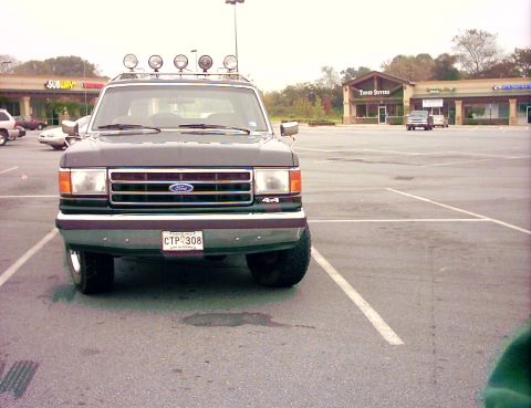 1990 Ford Bronco - This 1990 Ford Bronco is seen from the front, equipped with auxiliary lights on its roof rack.