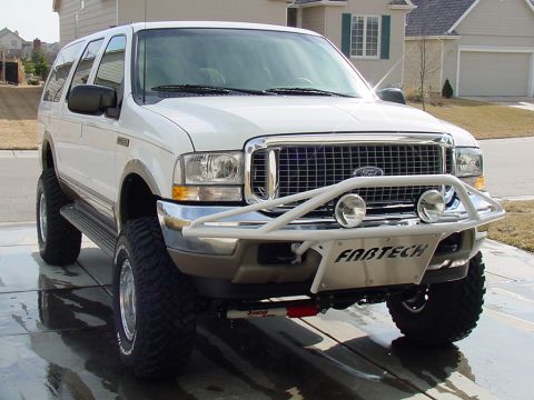 2002 Ford Excursion - This 2002 Ford Excursion features an aftermarket Fabtech bumper and large off-road tires.