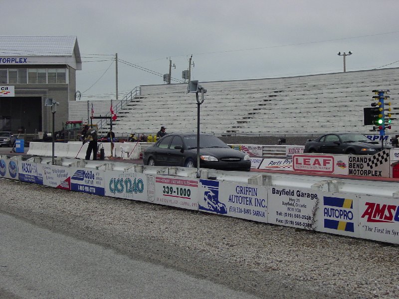 Black 2000 Ford Taurus on drag strip, front view