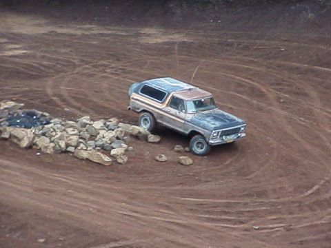 1978 Ford Bronco - 1978 Ford Bronco navigating a rocky dirt path.