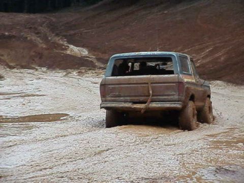 1978 Ford Bronco - This 1978 Ford Bronco is stuck deep in the mud, showing its rear end.