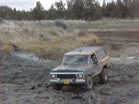 1978 Ford Bronco - This 1978 Ford Bronco navigates a muddy, off-road terrain.