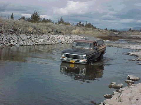 1978 Ford Bronco - This 1978 Ford Bronco is navigating through a water crossing on an overcast day.