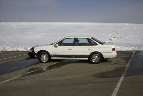 1995 Ford Taurus - Drivers side by the Mississippi. (other side of the hill.)