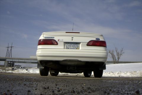 1995 Ford Taurus - Low rear shot. "SHO" type spolier, and a great piece broken off the center of my bumper. (near the bottom.) I think someone ate it up with…