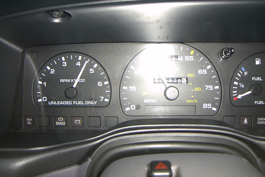 Instrument cluster with tachometer, speedometer reading MPH and km/h, and fuel gauge