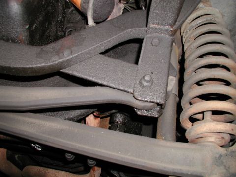 1977 Ford F-250 - Looks like stock bracket with I-beams bent for alignment