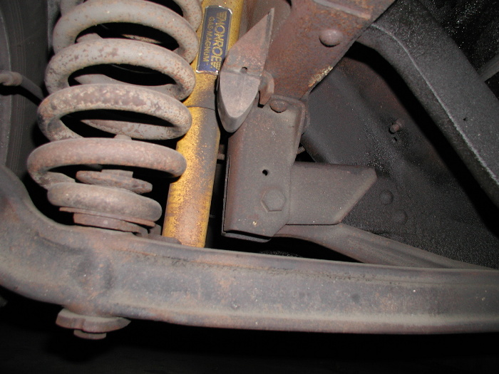 Passenger side I-beam bracket, you can see the stock rivets clearly